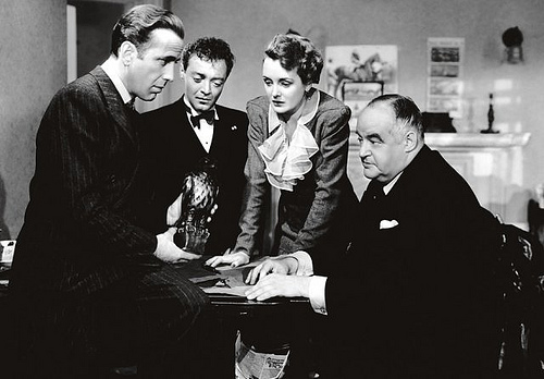 Bogart, Lorre, Astor and Greenstreet contemplate a falcon