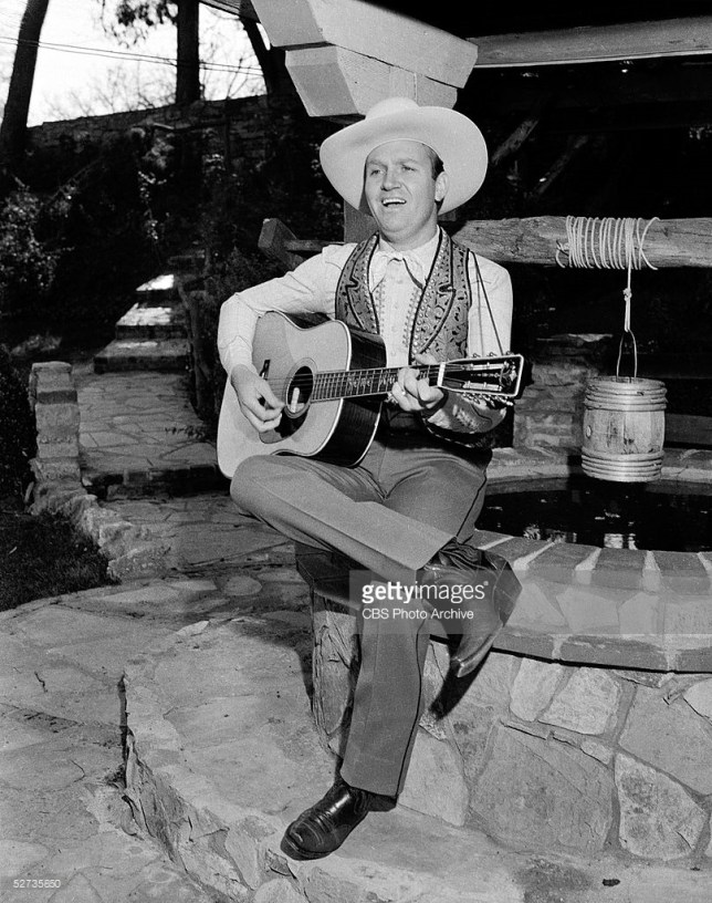 Gene Autry of the CBS radio program MELODY RANCH, at his home, posing 'candids'. January 1940. Copyright CBS Broadcasting Inc. All Rights Reserved. Credit: CBS Photo Archive. CBS code: 2744.
