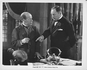 Dr. Doskil and the Inspector stand over the body of Sir Karell