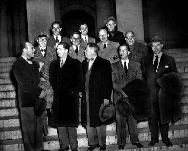 The "Hollywood 10" stand with their attorneys outside district court in Washington, D.C., Jan. 9, 1948 before arraignment on contempt of Congress charges. The ten were charged for refusing to cooperate with the House Un-American Activities Committee. (AP Photo)