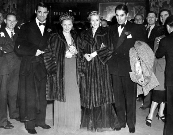 At The Pantages Theater for the Gunga Din premiere are Cary Grant, Annabella, Phyllis Brooks and Tyrone Power