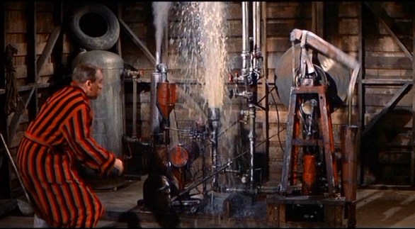 Mr. Hobbs wrestling with the water pump