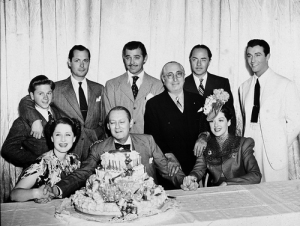 Mickey Rooney, Robert Montgomery, Clark Gable, William Powell, Robert Taylor, Norma Shearer, Lionel Barrymore & Rosalind Russell join Louis B. Mayer in celebrating Lionel Barrymore's 61st Birthday. April 28, 1939 - a Mayer favorite