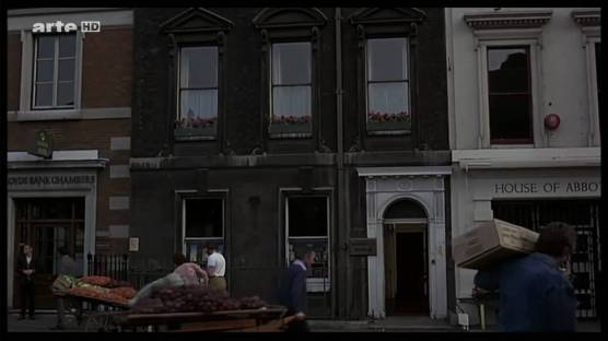 Londoners go about their business while a gruesome rape and murder takes place in this building