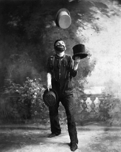 May 1900 --- W.C. Fields Juggling Top Hats --- Image by © Bettmann/CORBIS