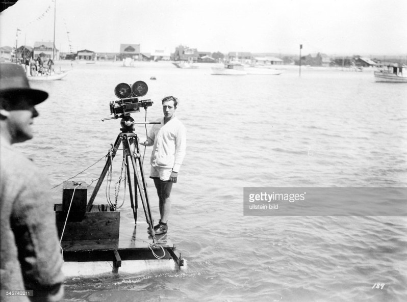 Buster at the camera filming College