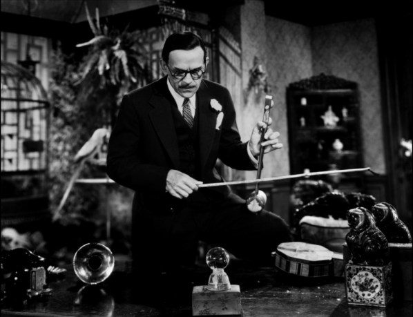 Mr. Wong as he discovers the poison gas is released with a sound of some kind.